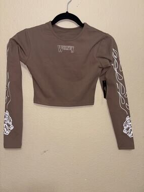 Darc Sport Wolves cropped long-sleeve performance top.